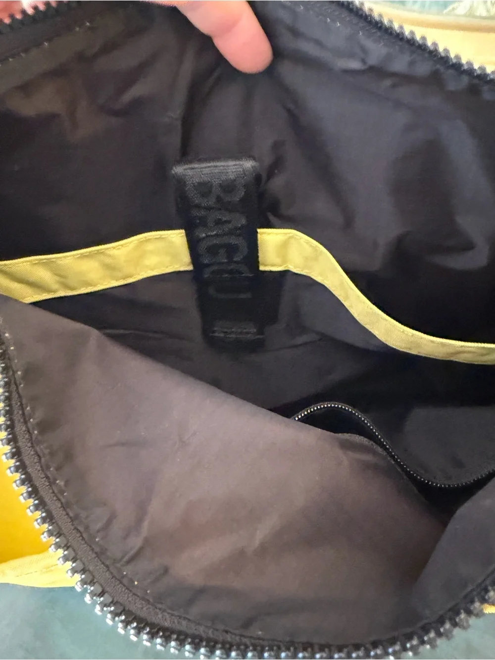 BAGGU nylon Messenger bag in bright chartreuse/yellow-green color known as Lemon